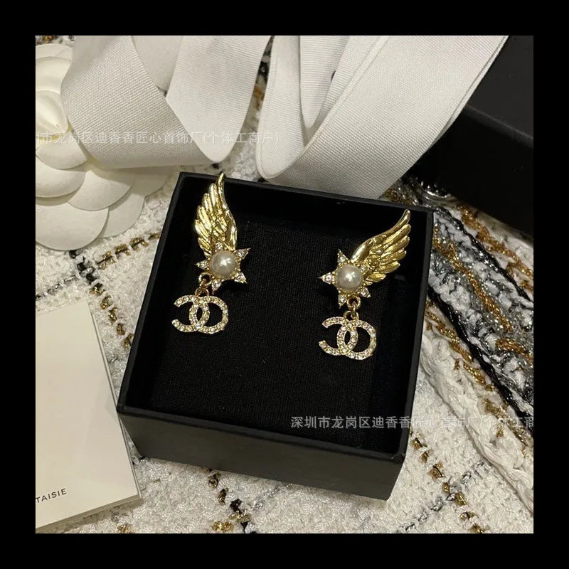 Earrings With Pearl & Wings Diamond Accents