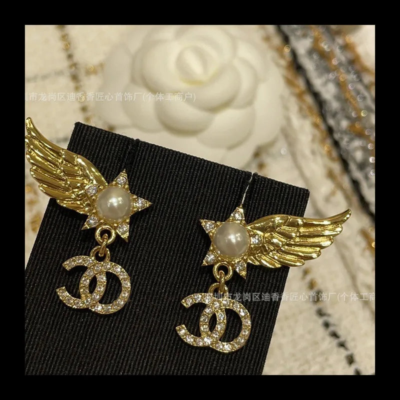 Earrings With Pearl & Wings Diamond Accents