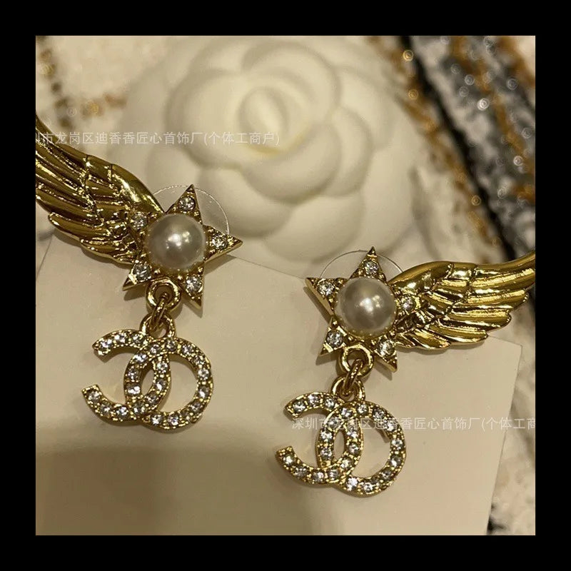 Earrings With Pearl & Wings Diamond Accents