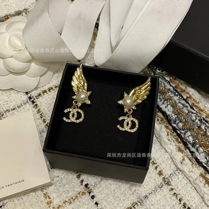 Earrings With Pearl & Wings Diamond Accents