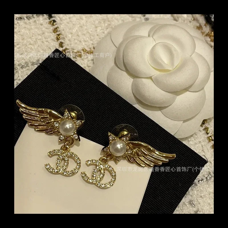 Earrings With Pearl & Wings Diamond Accents